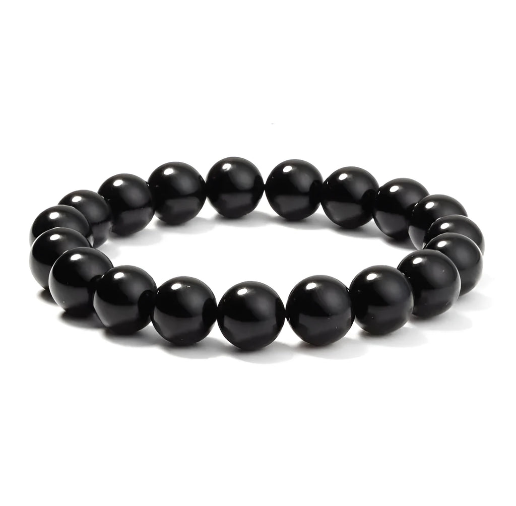 Black agate geometric bracelet with 8mm beads on a black elastic cord.