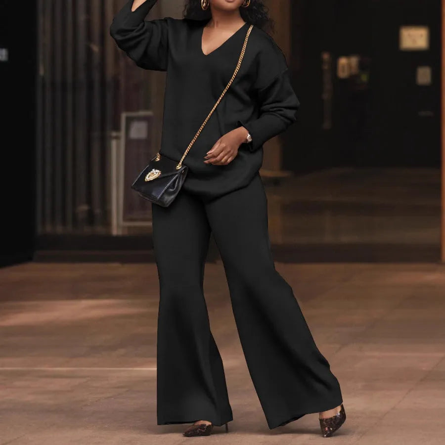 Women's brown thick suede two-piece suit with long sleeves and trousers, laid flat.
