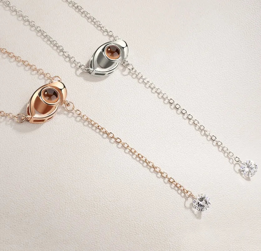 I love you 100 languages projection necklace, copper with gold plating, 50cm chain, pendant detail