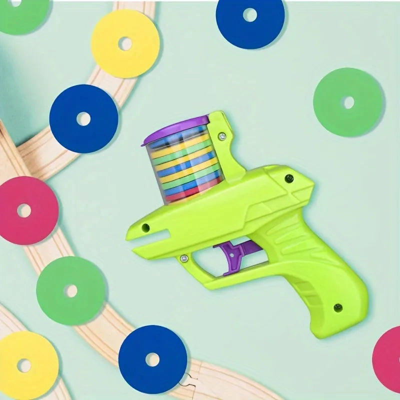 Interactive cat toy launcher with foam discs in green or purple durable plastic