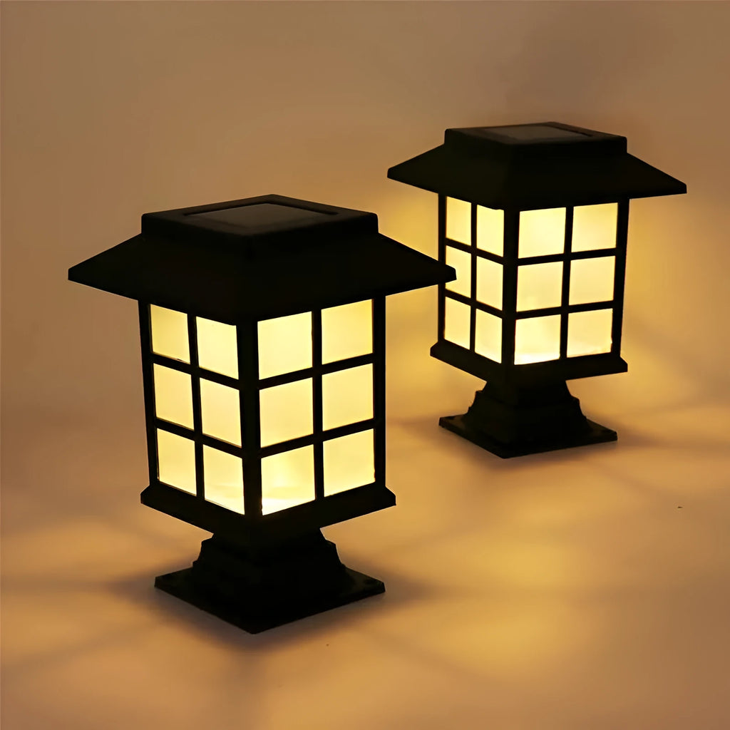 Black solar-powered LED lawn light for outdoor garden and pathway illumination with waterproof construction