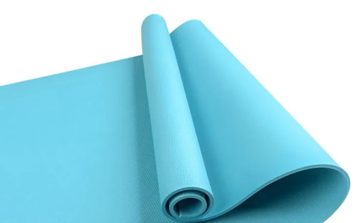 EVA fitness yoga mat in blue showing thickness and non-slip surface texture