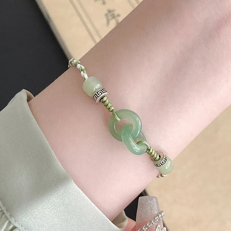 Women's ethnic style copper bracelet with peace buckle and double ring design in green.