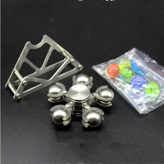 Silver spinning creative ferris wheel fingertip gyro on a neutral background
