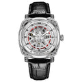 Men's stainless steel automatic watch with a leather strap on a wrist.