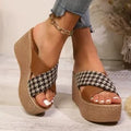 Brown and black plaid patterned casual wedge sandals with a rubber sole, shown on a white background.