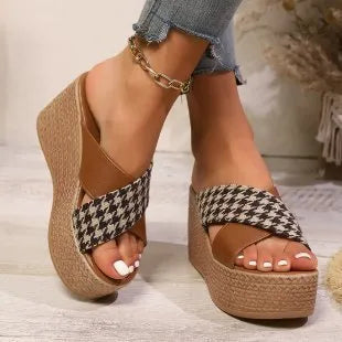 Brown and black plaid patterned casual wedge sandals with a rubber sole, shown on a white background.