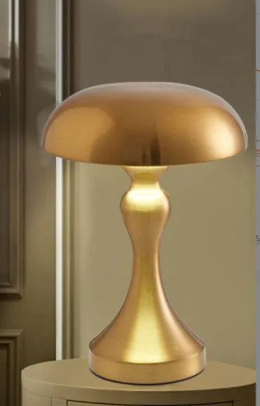 Metallic USB rechargeable LED desk lamp with touch control in bronze, gold, or silver finish.