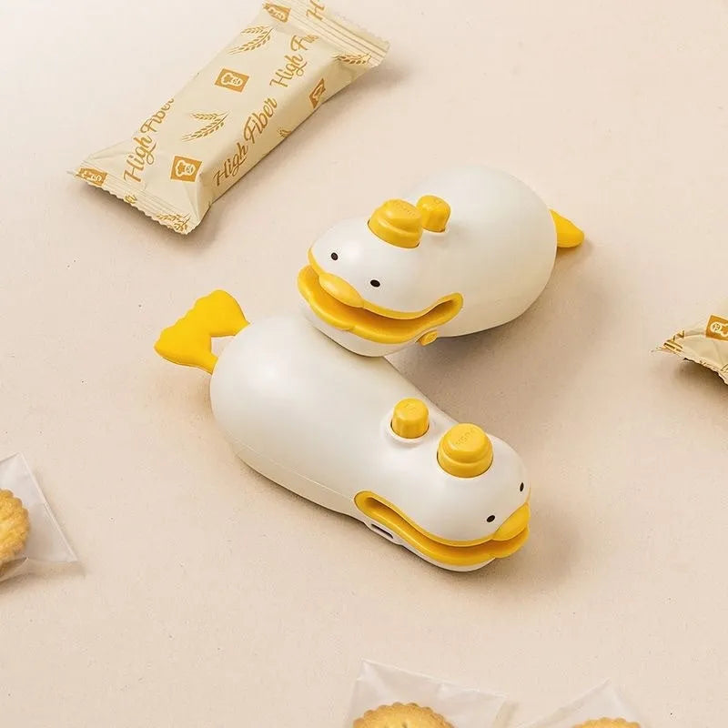 Yellow duck-shaped rechargeable electric bag sealer with animal jacquard pattern and charging cable
