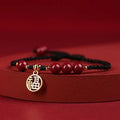 Cinnabar exam luck bracelet with braided rope strap and choice of bead or flower charm in ethnic style