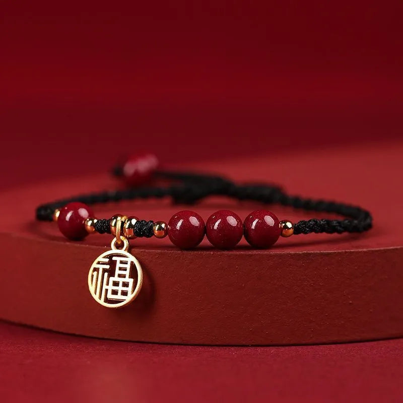 Cinnabar exam luck bracelet with braided rope strap and choice of bead or flower charm in ethnic style