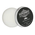 Mint scented shaving soap in aluminium box with rich foam on brush