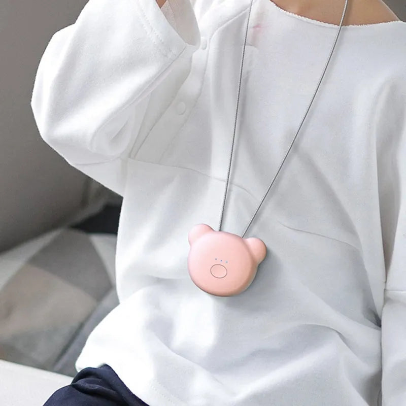 Mini USB rechargeable air purifier necklace in blue, shown with charging cable.
