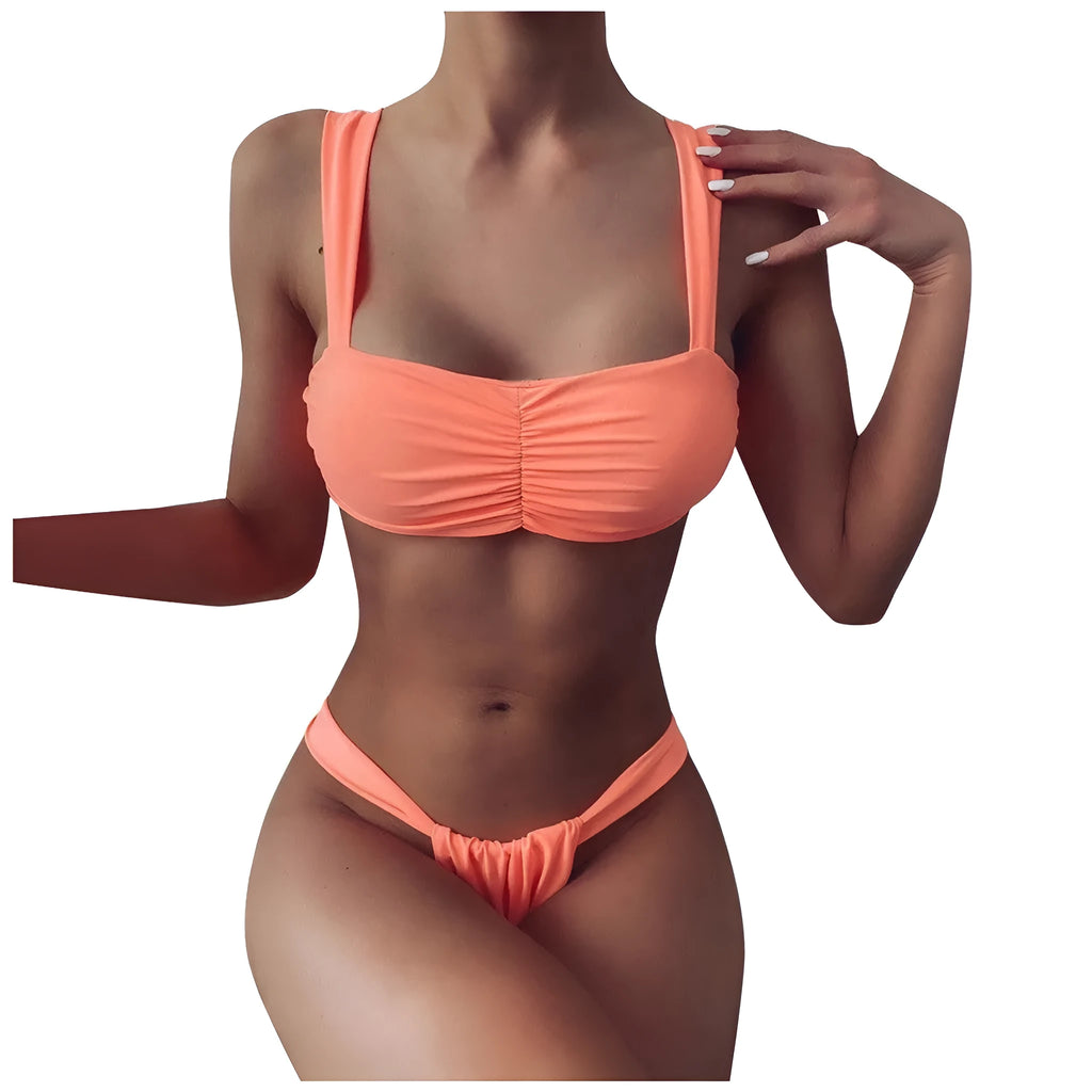 Solid colour split bikini swimsuit in orange on a model, showing two-piece design with nylon fabric