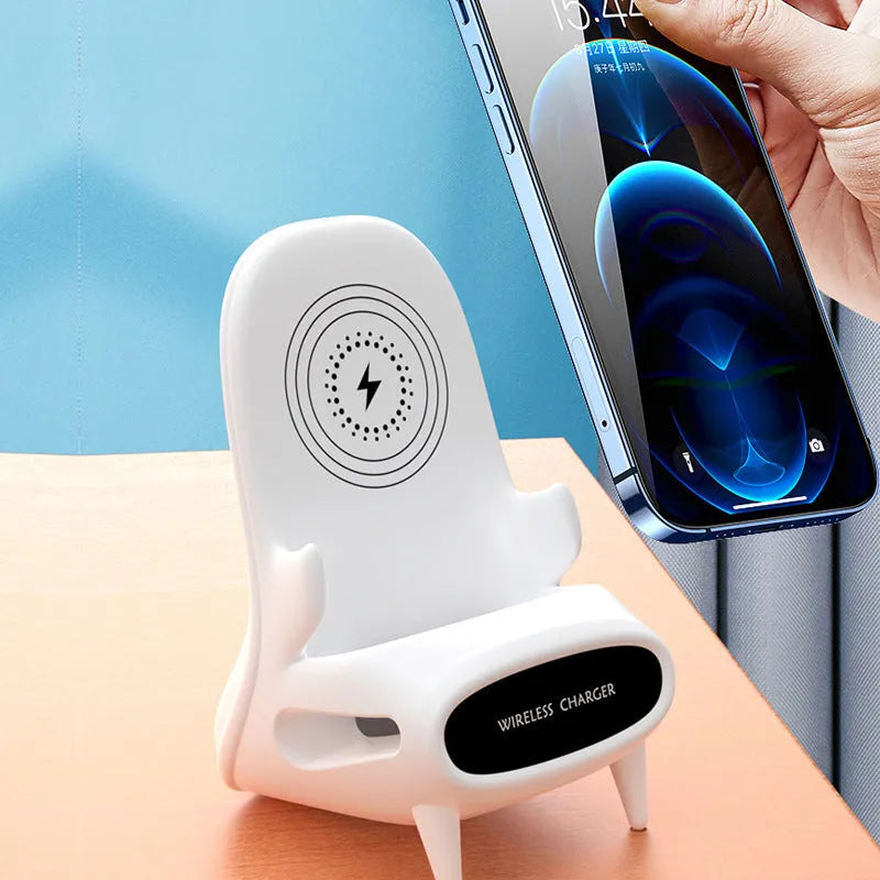 White mini chair-shaped wireless phone charger and holder on a desk