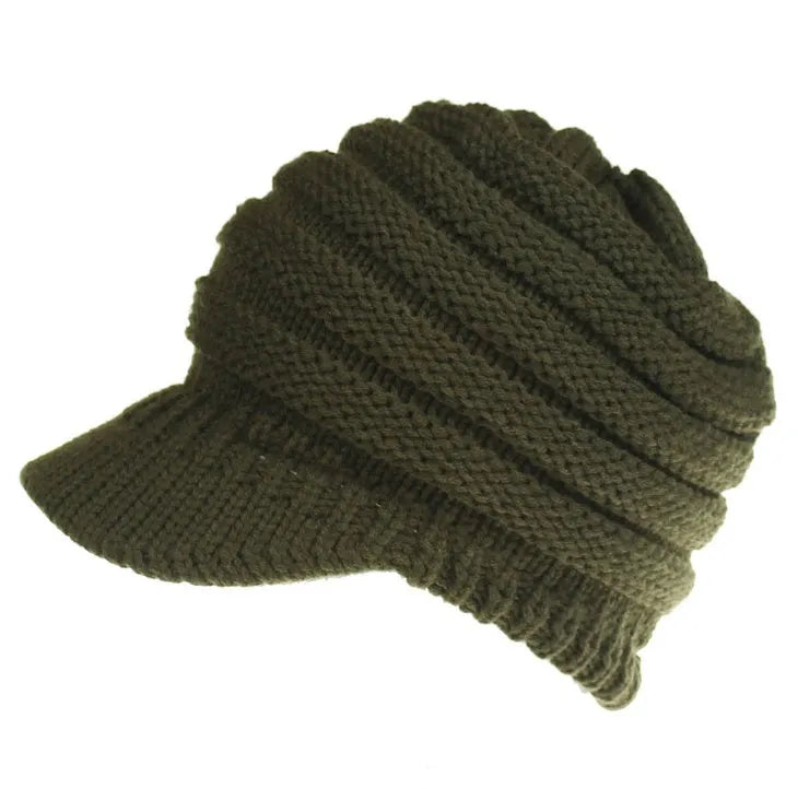 Women's knitted acrylic beanie hat designed for wearing with a ponytail or bun.