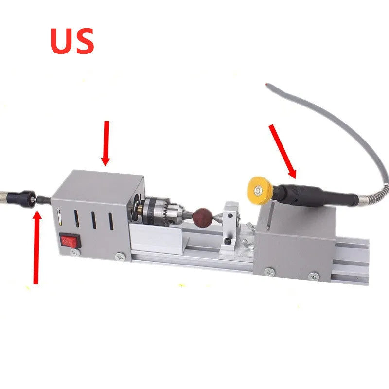 Silver metal mini woodworking lathe on a bench with carving knives and accessories.