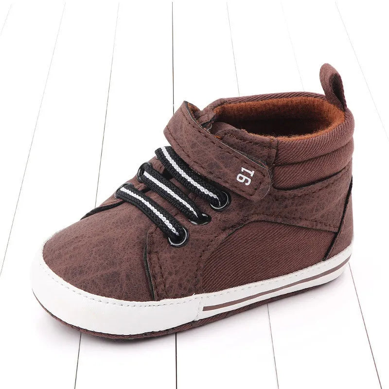 Blue high-top cotton toddler shoes for boys with a Velcro strap fastening.