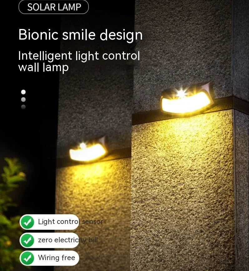 Solar outdoor wall lamp with decorative smiling face design for garden and courtyard lighting