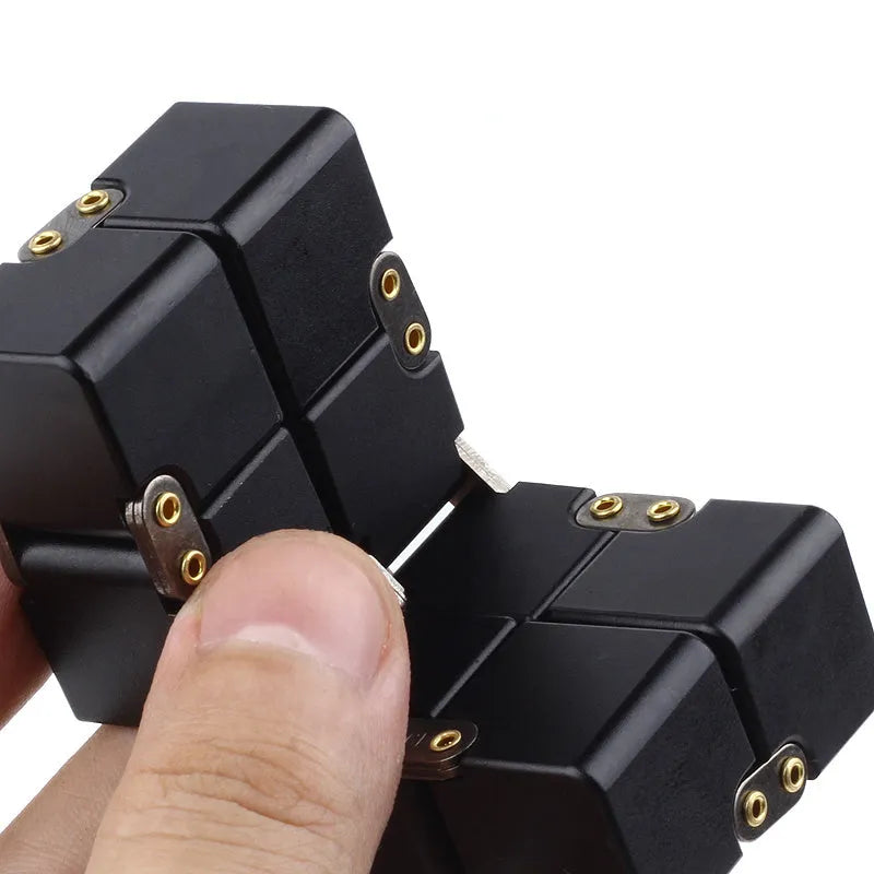 Zinc alloy infinity cube fidget toy showing black metallic finish and rotatable cube design