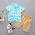 Infant anchor print cotton romper set in blue, showing short sleeves and matching trousers