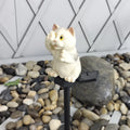 Brown cat-shaped solar-powered lawn light for garden decoration.