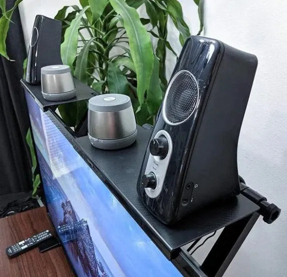 Black adjustable 13-inch screen top shelf for monitor or TV with TV box, router and remote on top.