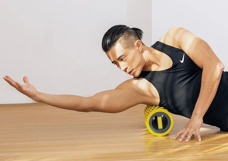 Blue and yellow manual massage equipment for fascia relaxation, used for muscle recovery.