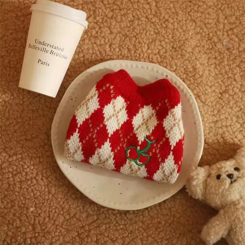Red cat sweater with cherry pattern and rhombic embroidery, shown on a model cat.