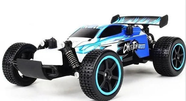 Blue and yellow 1:18 scale remote control drift car with 2.4GHz transmitter on a flat surface