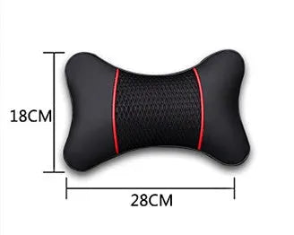 Green leather car headrest neck pillow with black red reversible colour, placed on a car seat for neck support