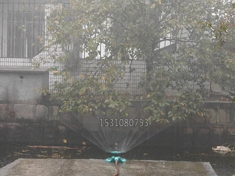 360 Rotating Sprinkler with Big 3 fork design on garden lawn, 210mm x 190mm x 95mm