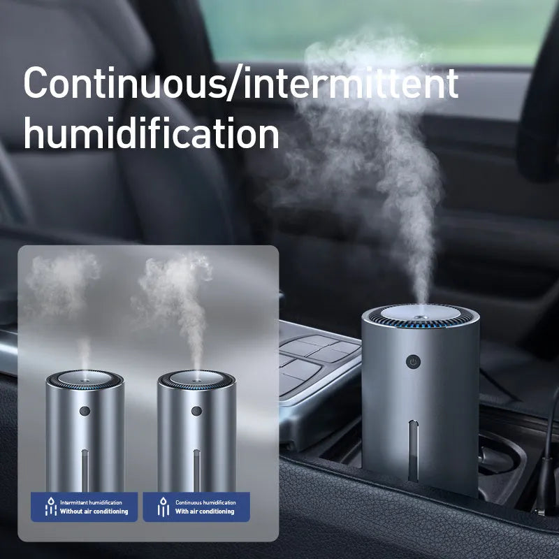 Black aluminium alloy car diffuser humidifier with USB cable on a desk.