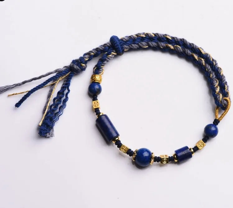 Hand-woven ethnic watch bracelet in flexible wire, showing Hongfei Ebony and Lapis Lazuli colour options.