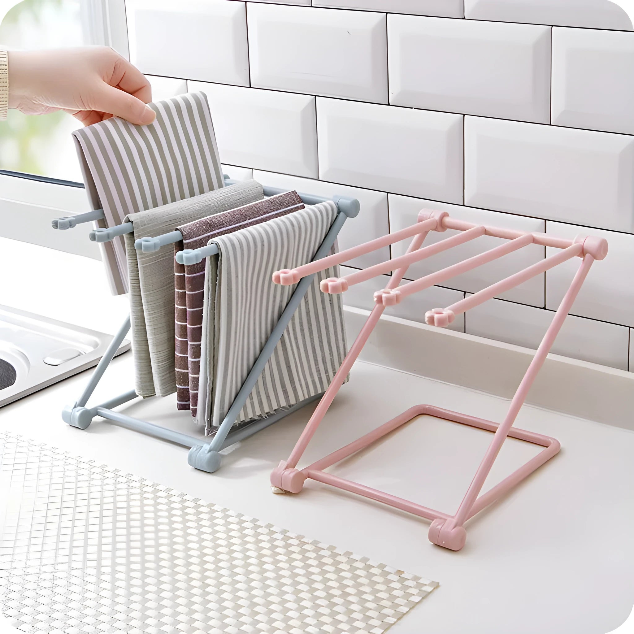 Foldable plastic dishcloth shelf in light blue with bottles stored vertically