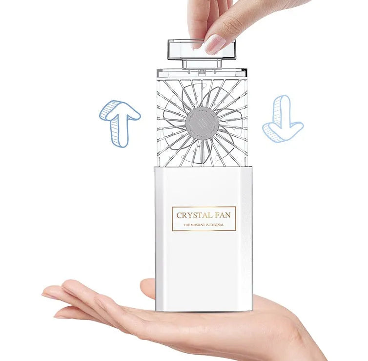 Pink portable perfume fan with USB charging port and integrated rechargeable battery