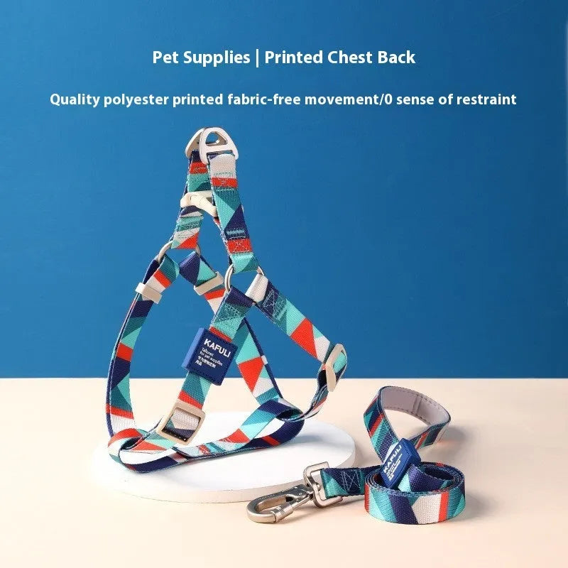 Blue polyester dog harness vest connected to a matching haulage rope on a grassy background.