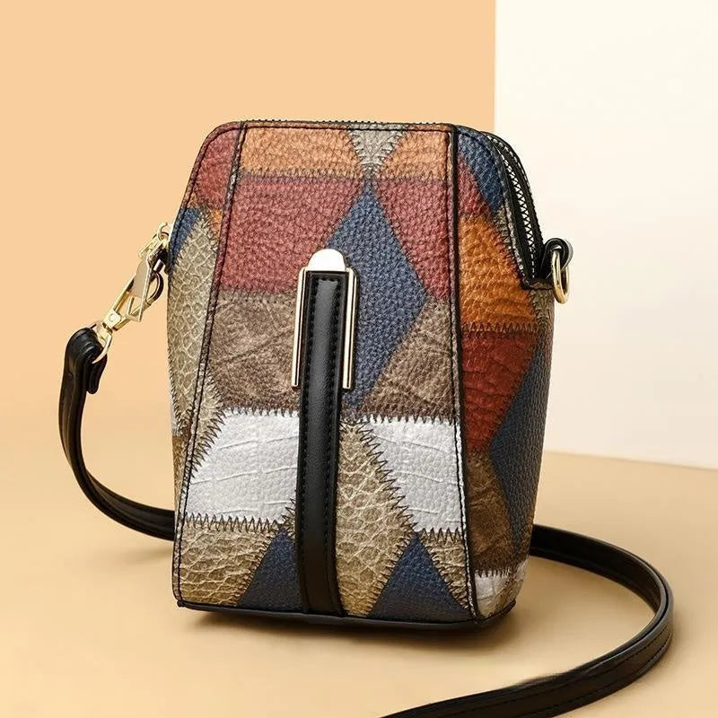 Soft PU shoulder bag with stitching detail, single strap, sandwich pocket, in irregular blue and black or blue and brown.