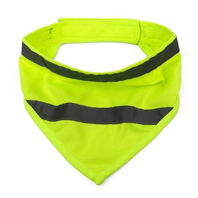 Yellow and orange reflective dog bandana with adhesive strap, shown on a dog's neck.