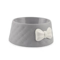 Bow shaped pet feeding bowl in PP plastic available in pink, green, and grey