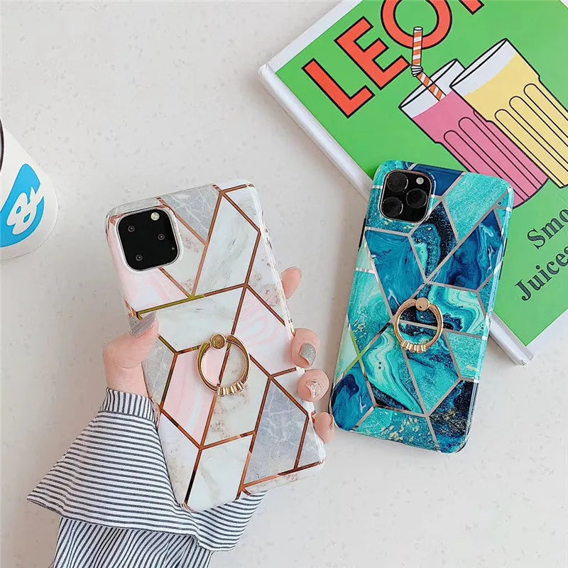 Geometric plating ring on a slim blue iPhone back cover case, showing the stand function.