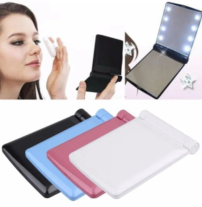 Folding LED pocket cosmetic mirror in black, blue, pink, and white, compact travel makeup mirror with built-in light.
