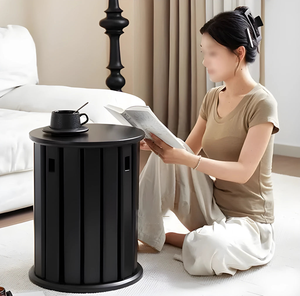 A stackable round metal dining stool in a modern style, shown in a choice of colours.