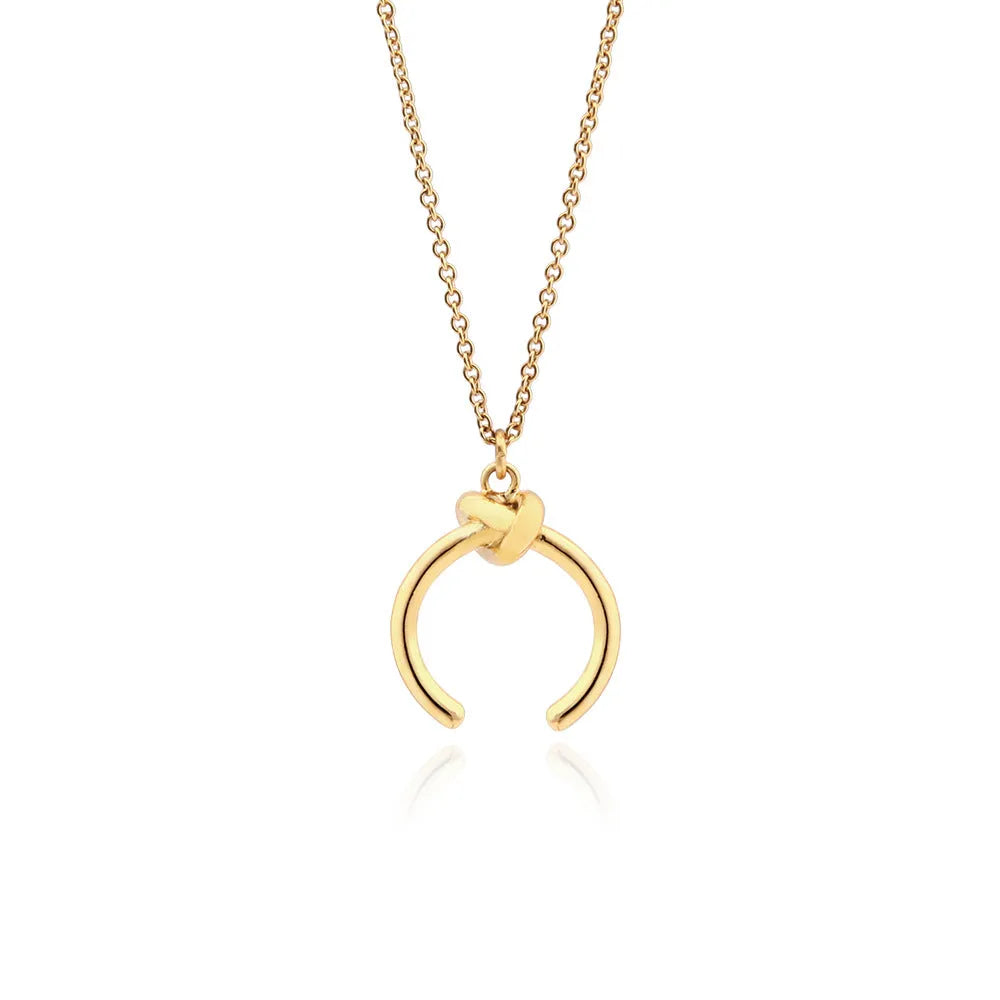 Geometric copper pendant necklace on a cross chain with gold or silver electroplated finish.