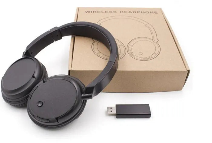 Black stereo wireless headphones with USB FM transmitter showing 30-metre range capability