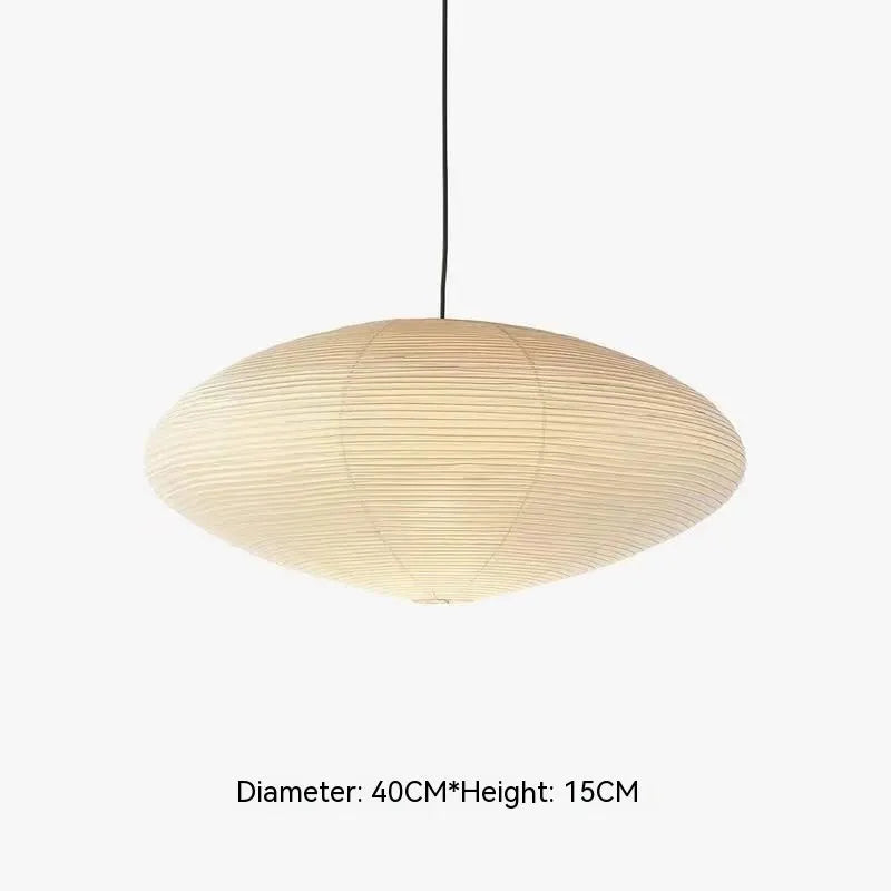 Modern simple paper pendant lamp with spherical or flat shade, shown in a bedroom or dining room setting.