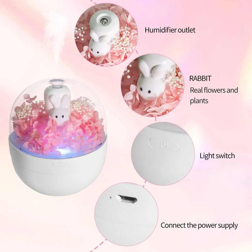 Pink Creative Rabbit aromatherapy humidifier with preserved flowers on top.