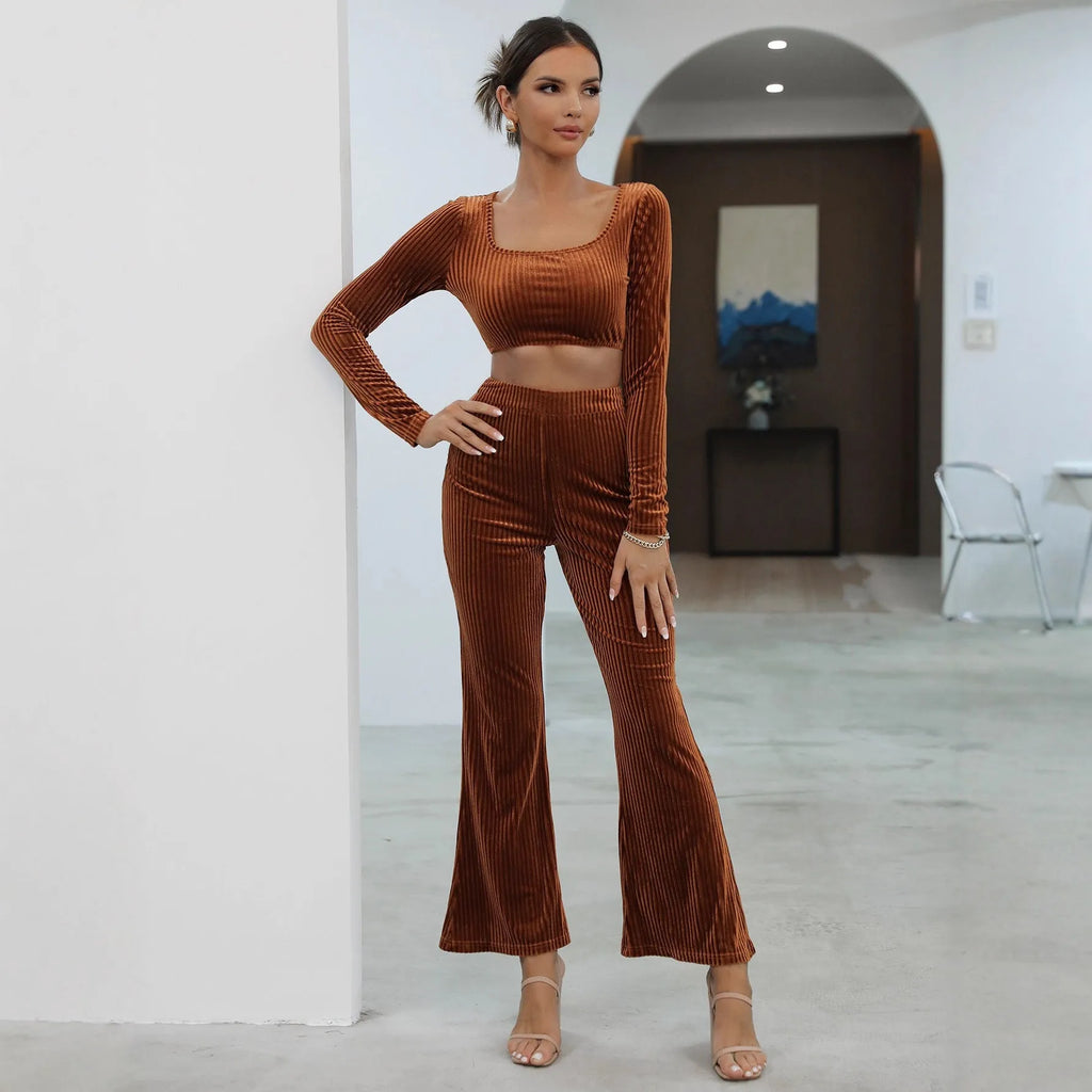 Caramel coloured long sleeve sweater and matching trousers casual set laid flat.