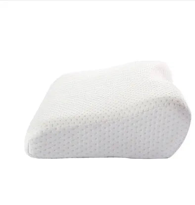 Blue butterfly-shaped memory foam cervical neck pillow on a bed