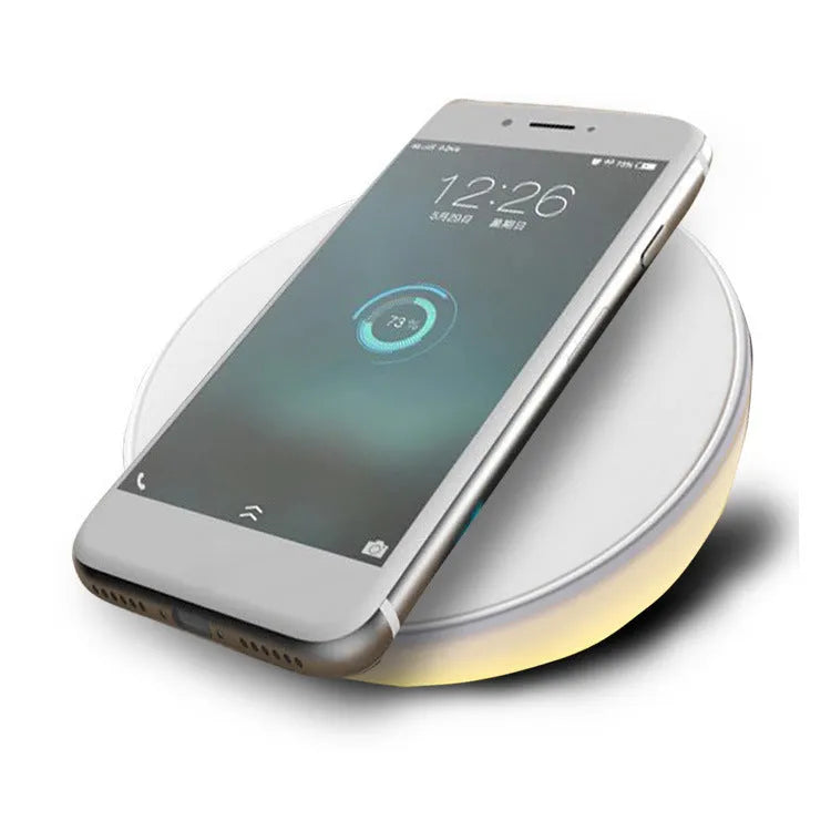 White smart wireless charger with digital clock display and three control buttons.